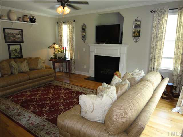 2 Rosemeade Place Durham, NC 27712 - Photo 11 of 20 a living room with furniture and a fireplace