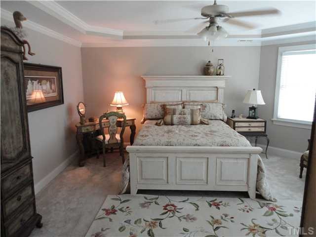 2 Rosemeade Place Durham, NC 27712 - Photo 12 of 20 a bedroom with a bed and wooden floor