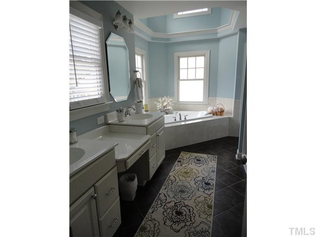 2 Rosemeade Place Durham, NC 27712 - Photo 13 of 20 a bathroom with a double vanity sink and a mirror
