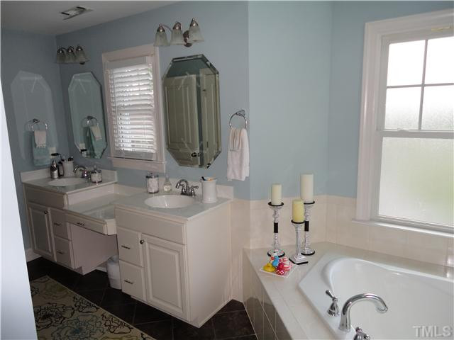 2 Rosemeade Place Durham, NC 27712 - Photo 14 of 20 a bathroom with a double vanity sink mirror and bathtub