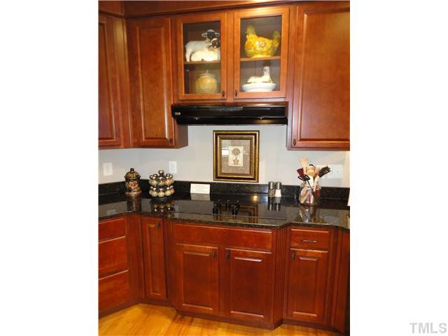 2 Rosemeade Place Durham, NC 27712 - Photo 9 of 20 a kitchen with granite countertop a sink and cabinets