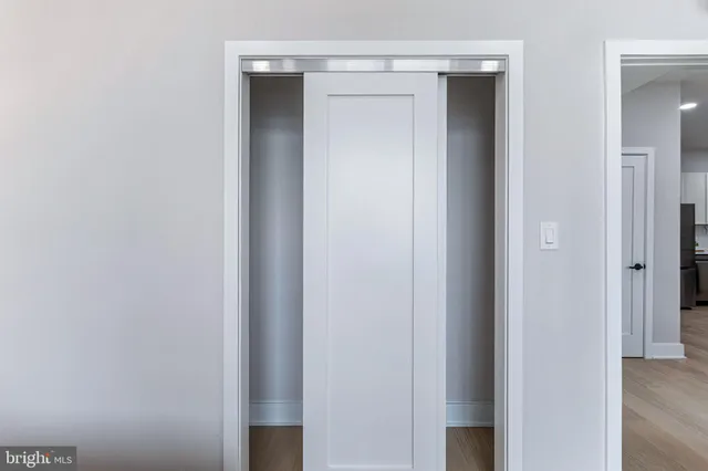 a living room with a bed furniture and a window