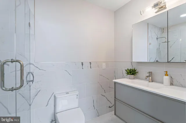 a view of a brick building next to a yard