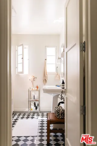 a bathroom with a sink and a mirror