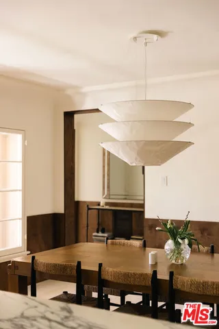 a kitchen with a table and chairs in it