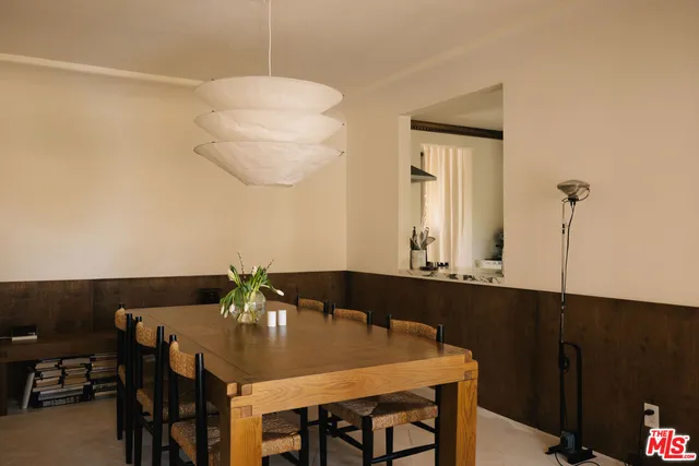a view of a living room and a potted plant