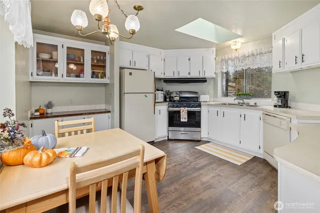 a kitchen that has a cabinets counter space and stainless steel appliances