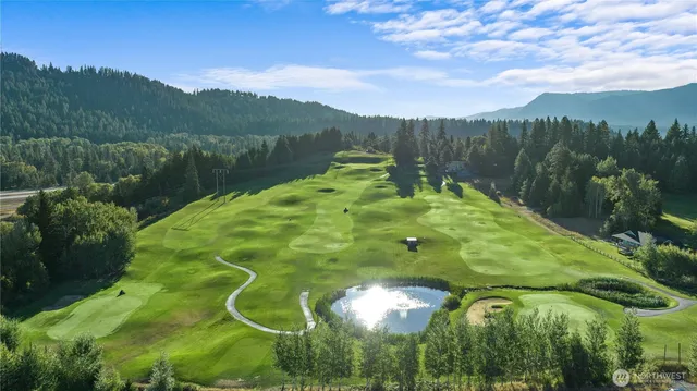 a swimming pool with mountain view