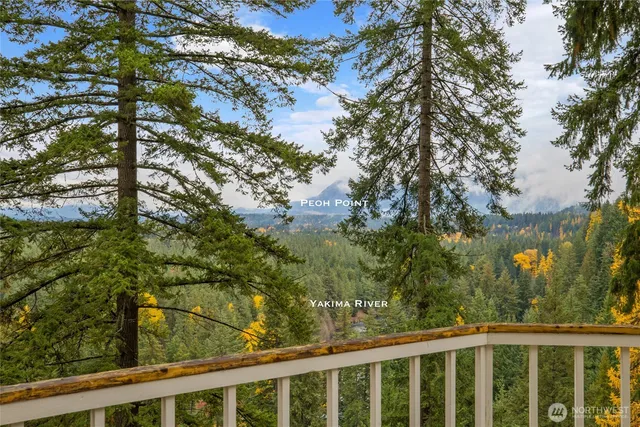 a view of a balcony with wooden fence and floor
