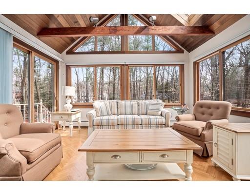 3 Virginia Place Wenham, MA 01984 - Photo 1 of 30 a living room with furniture a large window and a chandelier