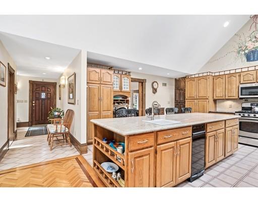 3 Virginia Place Wenham, MA 01984 - Photo 9 of 30 a kitchen with stainless steel appliances granite countertop a stove top oven a sink dishwasher and cabinets with wooden floor
