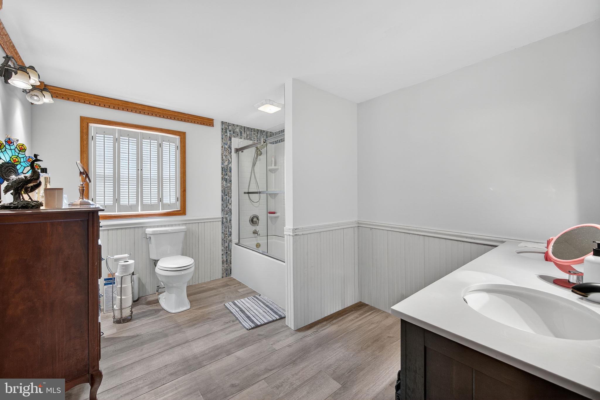 3337 Downs Chapel Road Clayton, DE 19938 - Photo 17 of 54 a bathroom with a sink toilet and shower