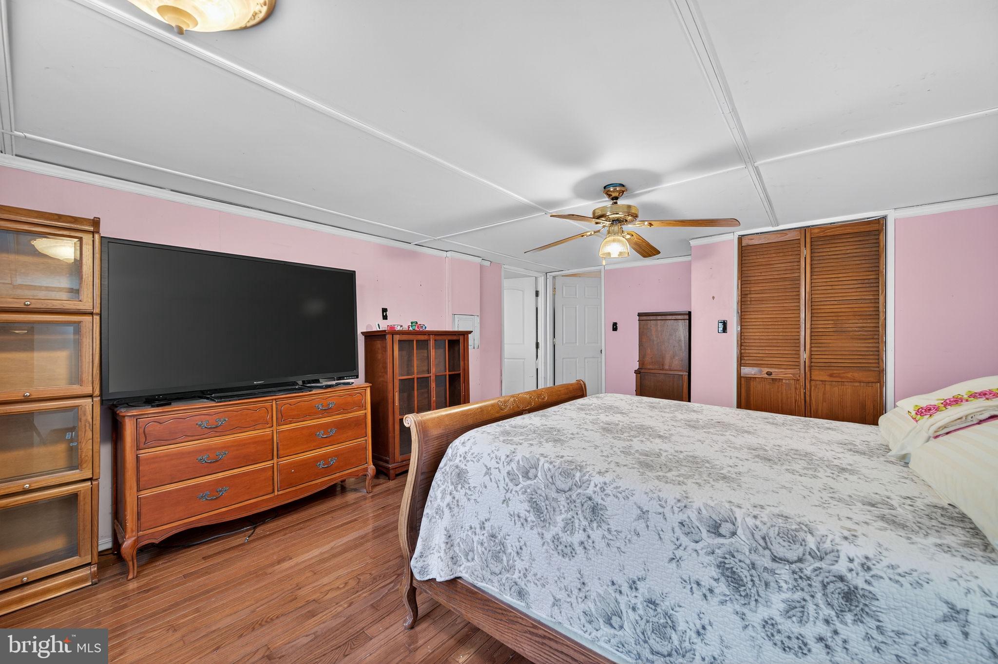 3337 Downs Chapel Road Clayton, DE 19938 - Photo 22 of 54 a bedroom with furniture and a flat screen tv