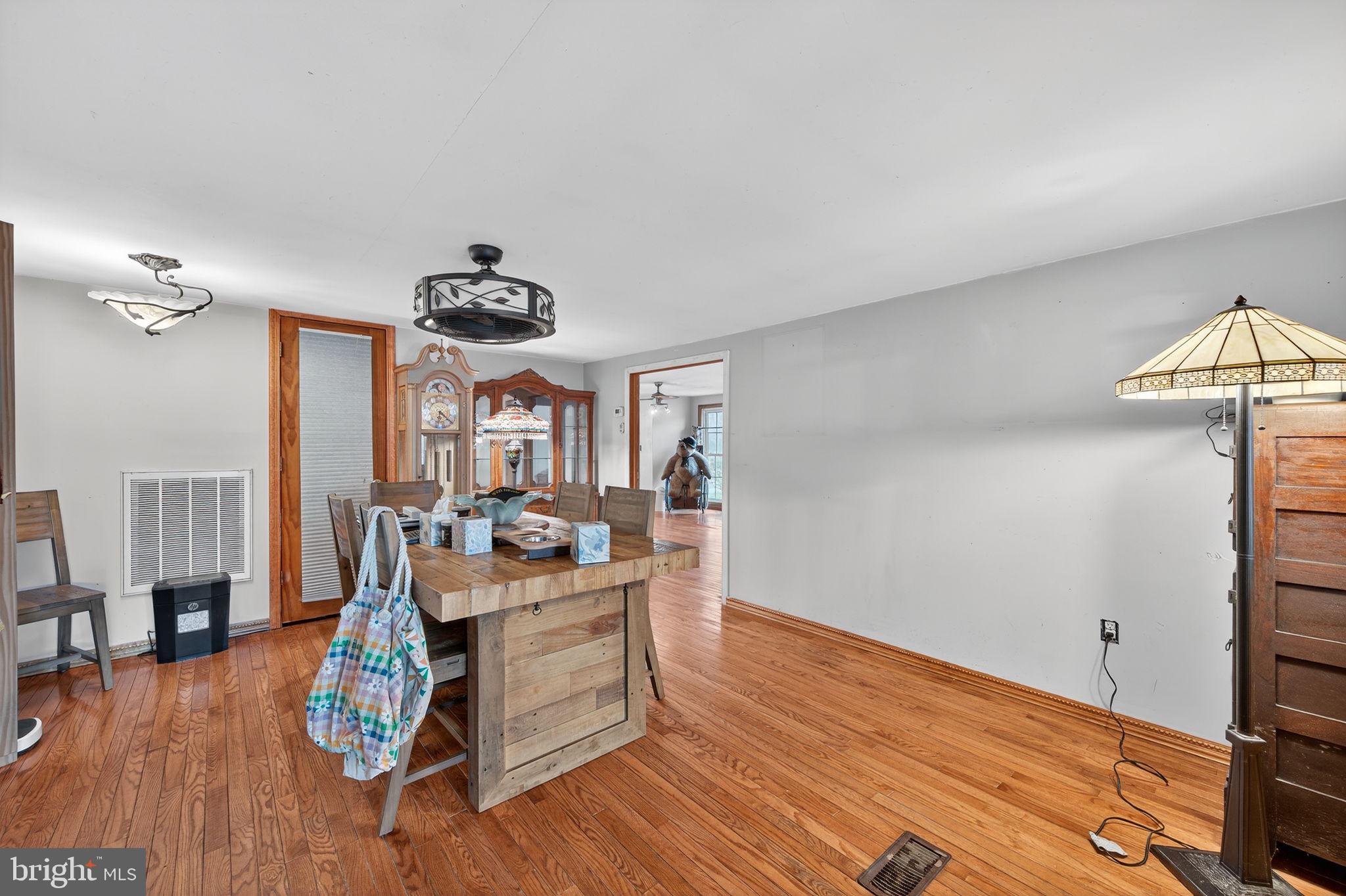 3337 Downs Chapel Road Clayton, DE 19938 - Photo 25 of 54 a dining room with furniture and wooden floor