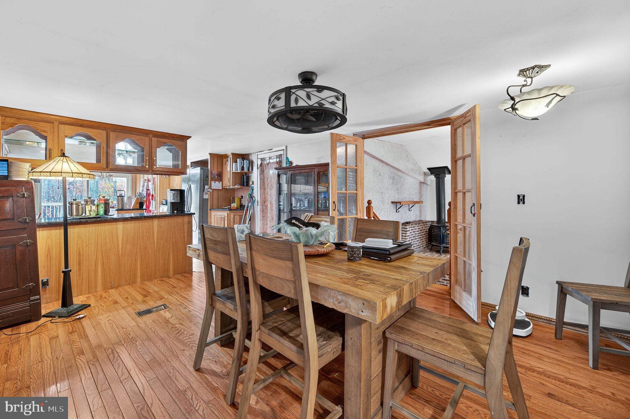 3337 Downs Chapel Road Clayton, DE 19938 - Photo 26 of 54 a view of a dining room with furniture and wooden floor