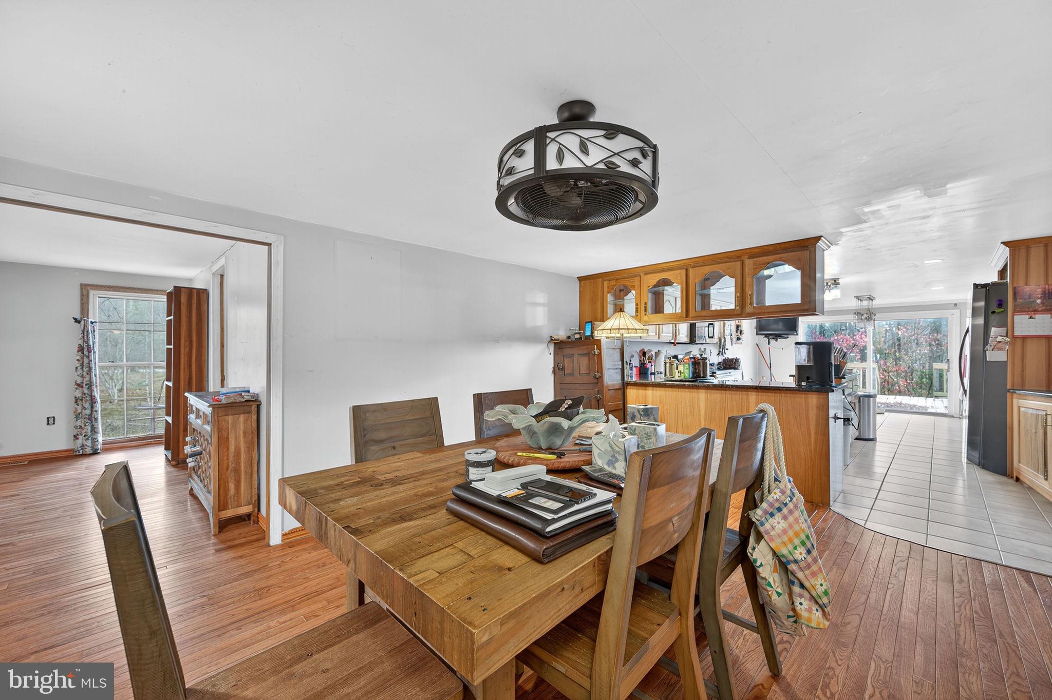 3337 Downs Chapel Road Clayton, DE 19938 - Photo 27 of 54 a view of a dining room with furniture wooden floor and a clock