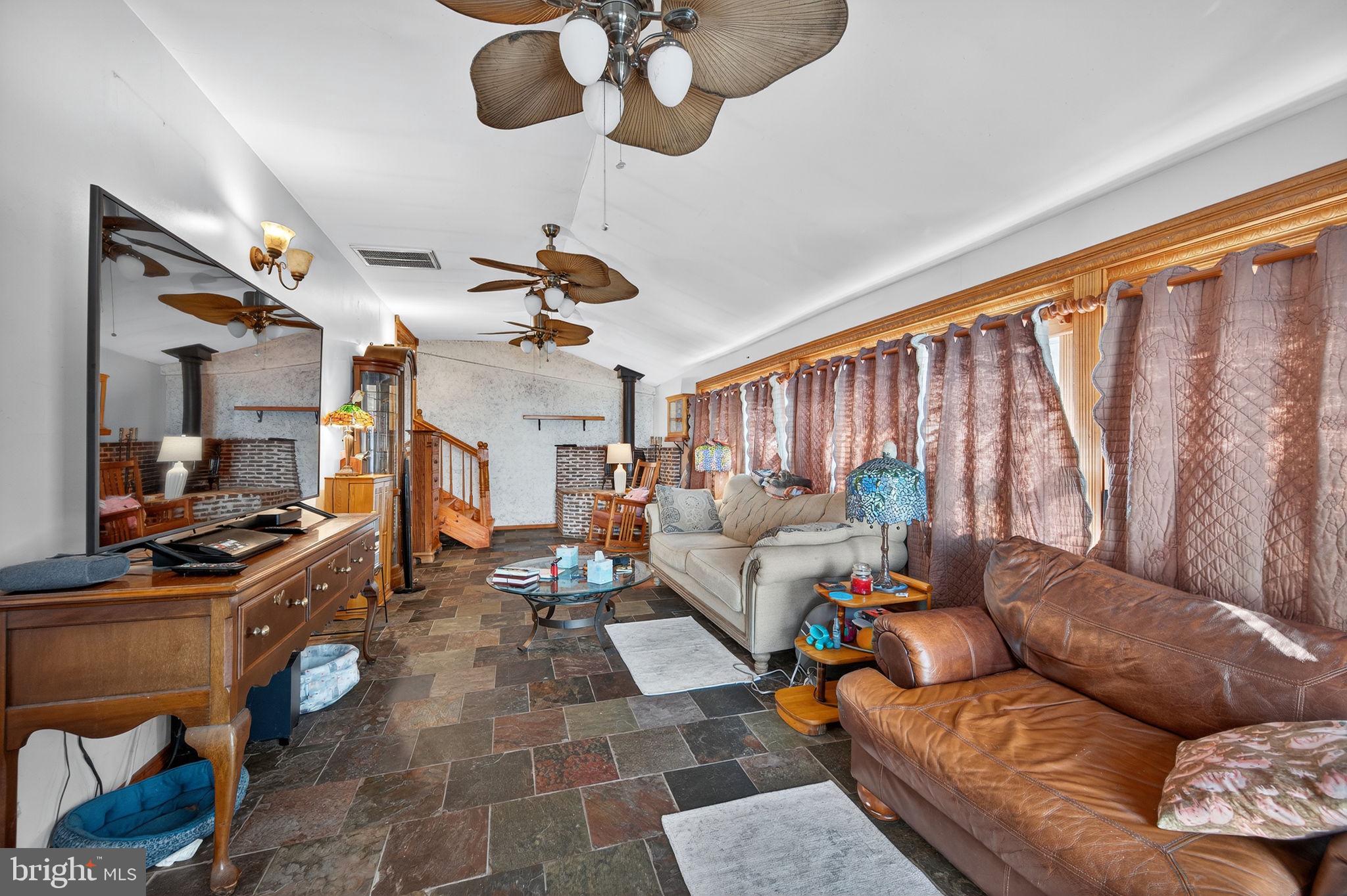 3337 Downs Chapel Road Clayton, DE 19938 - Photo 39 of 54 a living room with furniture fireplace and a window