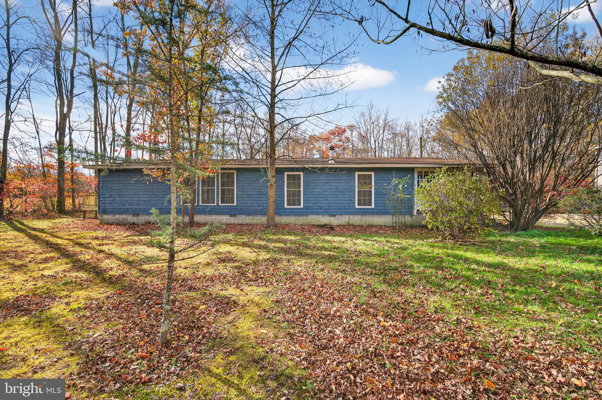 3337 Downs Chapel Road Clayton, DE 19938 - Photo 4 of 54 a front view of a house with a garden
