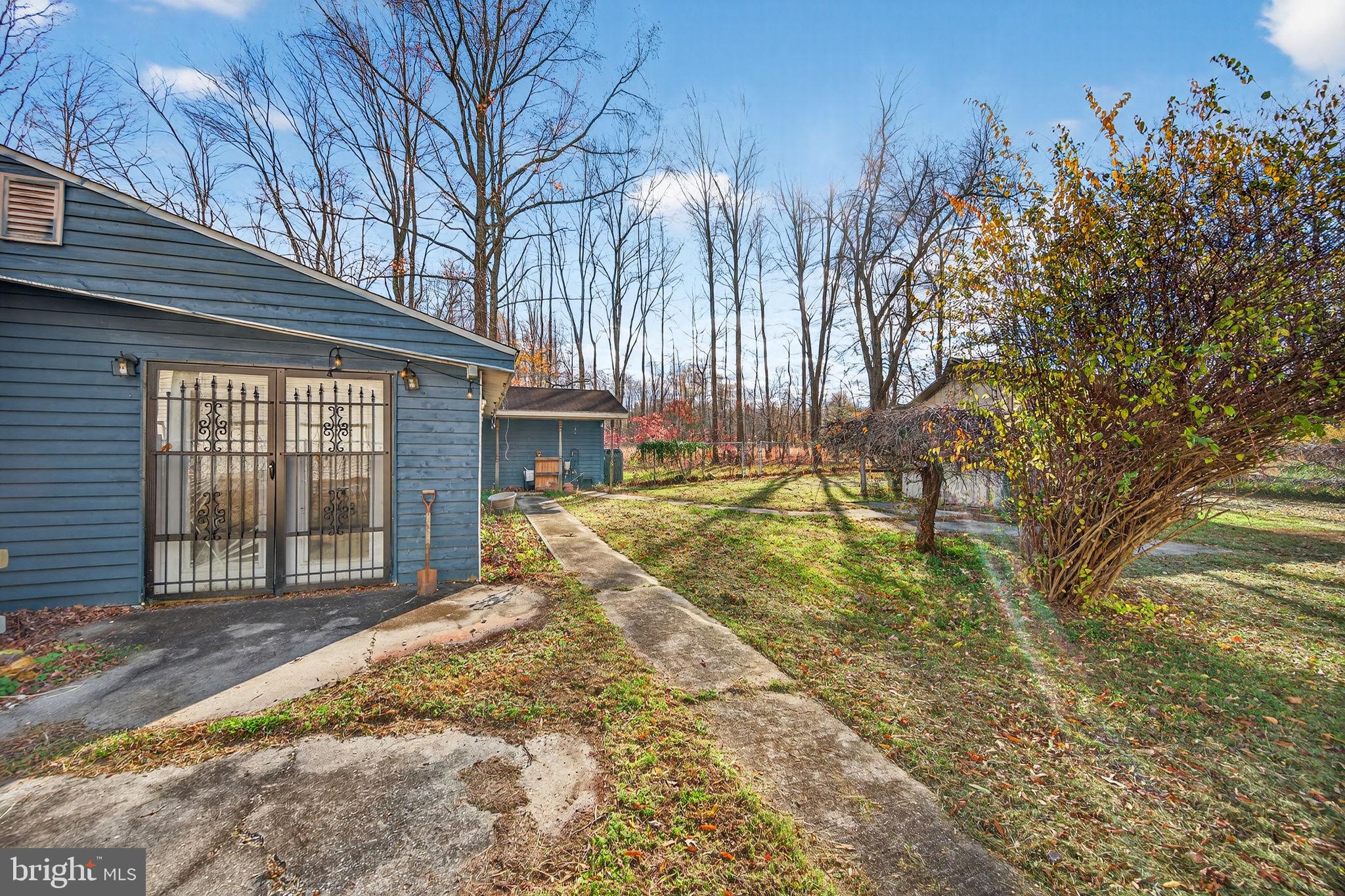 3337 Downs Chapel Road Clayton, DE 19938 - Photo 46 of 54 a view of a house with a large tree and a yard