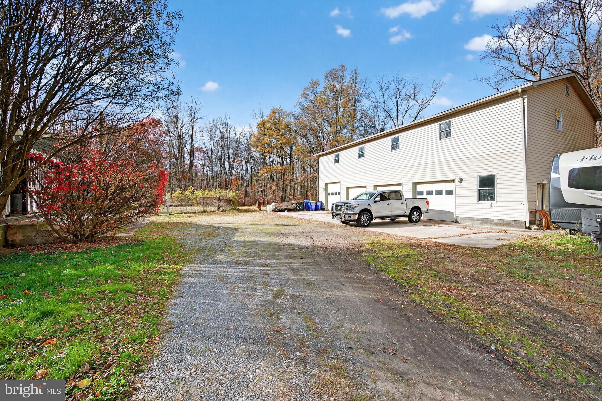 3337 Downs Chapel Road Clayton, DE 19938 - Photo 48 of 54 a car parked in front of white house