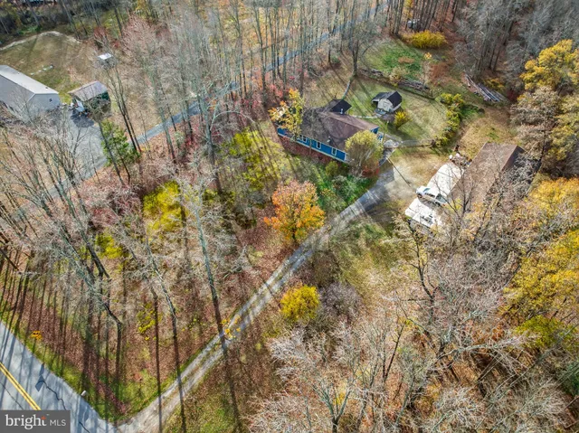 a bird view of a house with a yard