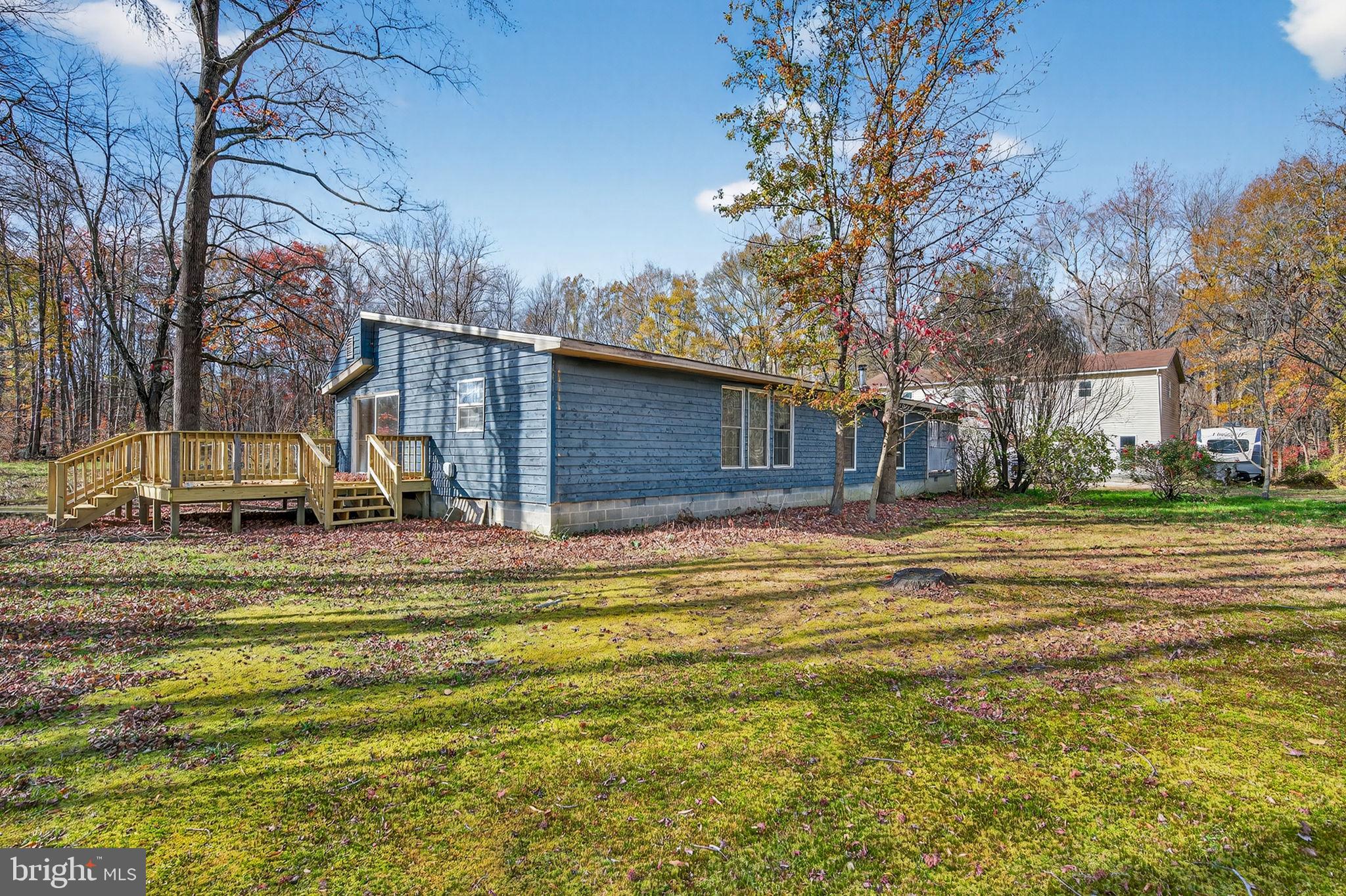 3337 Downs Chapel Road Clayton, DE 19938 - Photo 5 of 54 a view of a house with a yard and large trees