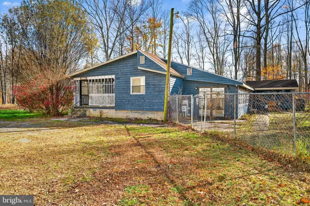 a house that has a tree in front of it