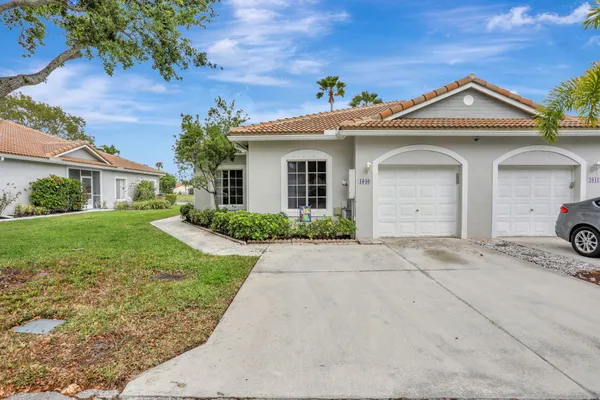 front view of a house with a yard