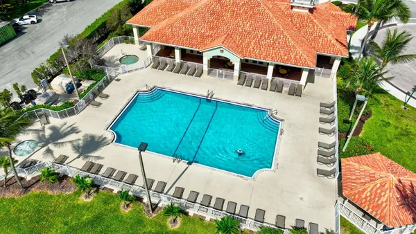 an aerial view of a house with a yard and garden