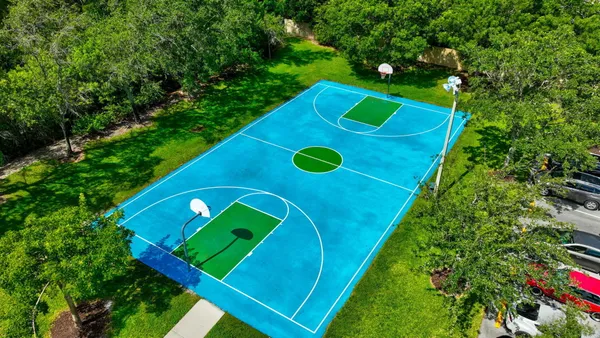 a view of a golf club with a backyard