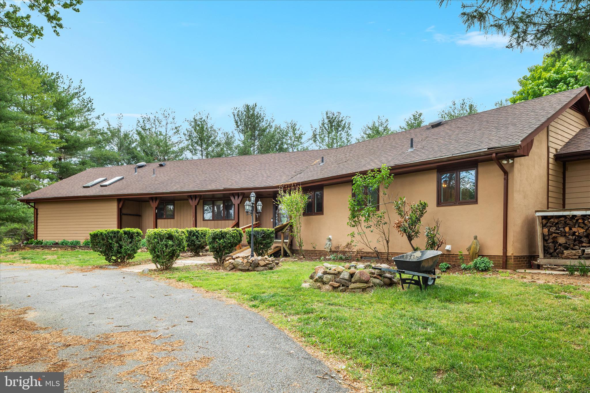 263 Bowling Green Road Front Royal, VA 22630 - Photo 46 of 75 a view of a house with backyard sitting area and garden