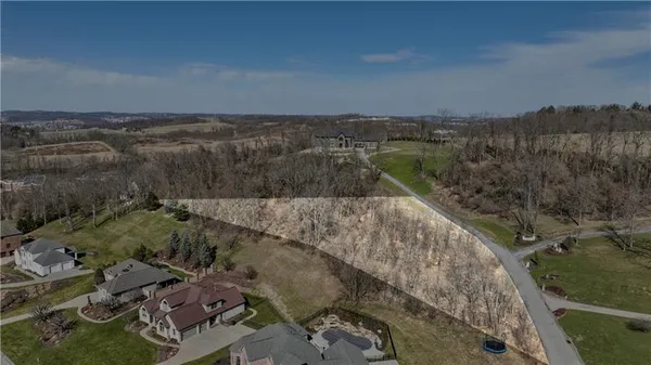 an aerial view of residential house and outdoor space