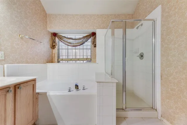 a bathroom with a bathtub a sink and a mirror