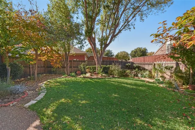 a view of backyard with green space