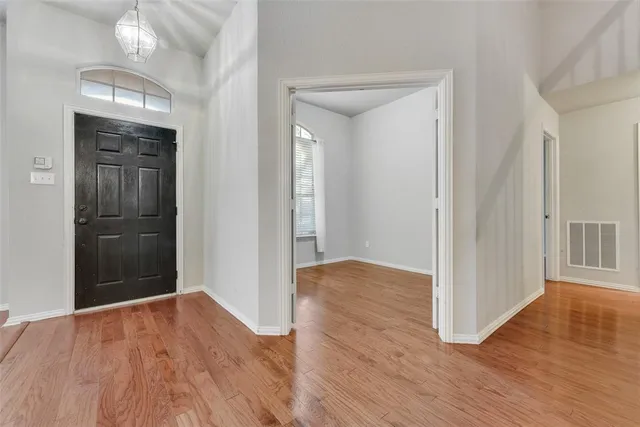 wooden floor in a hall with an entryway space