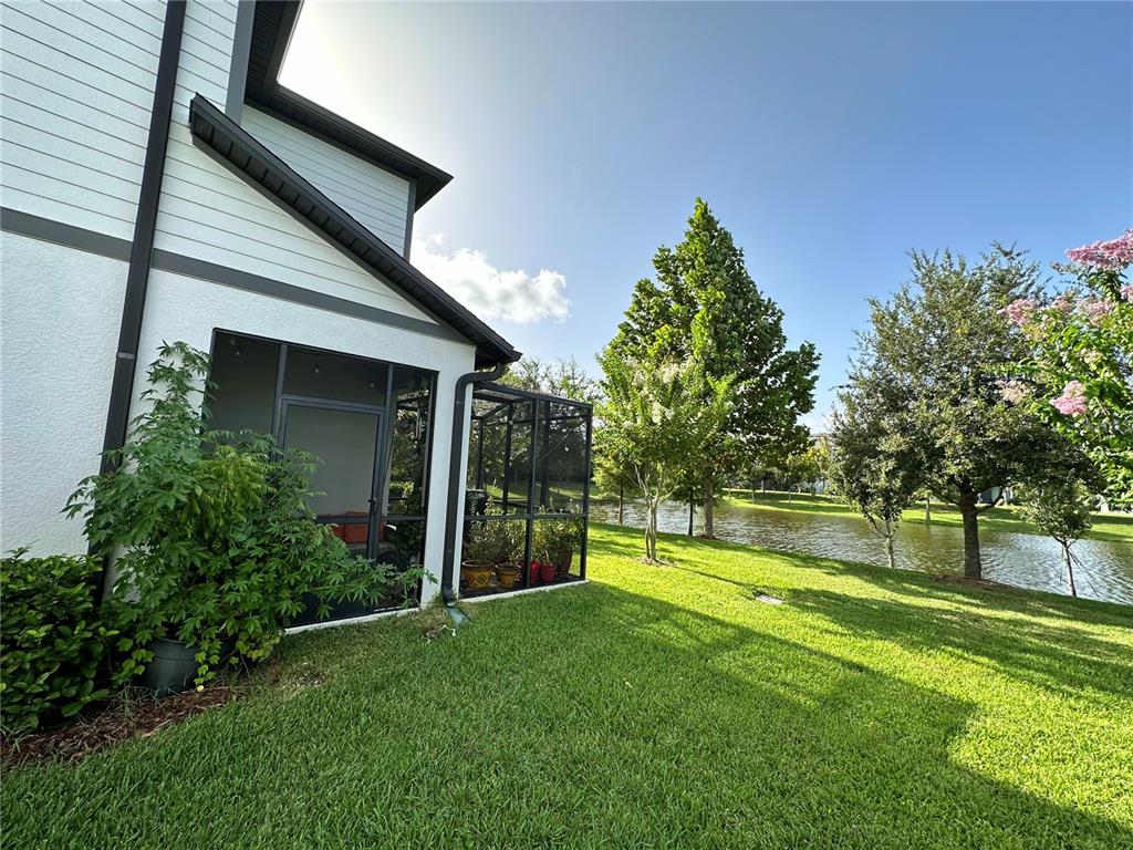250 Rustic Loop Sanford, FL 32771 - Photo 31 of 33 a view of a house with a big yard and potted plants