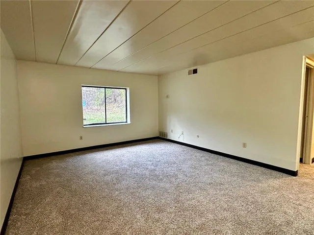 a view of a room that has a window in it