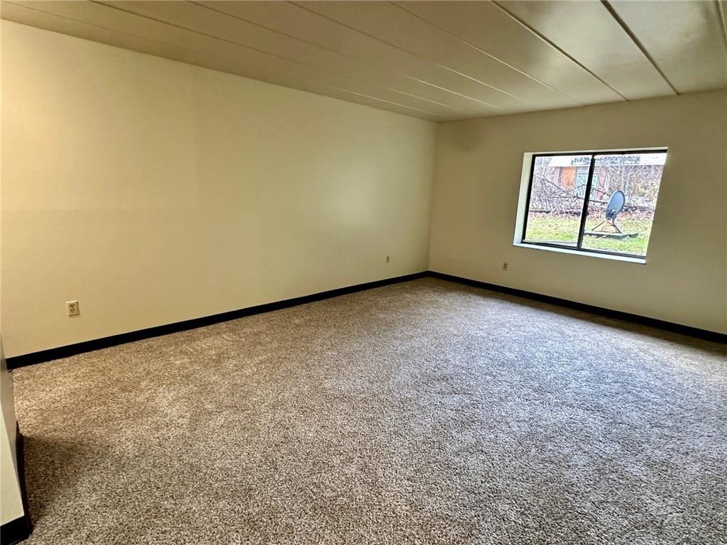 210 Electric Avenue, Unit B3 East Pittsburgh, PA 15112 - Photo 4 of 9 an empty room with windows