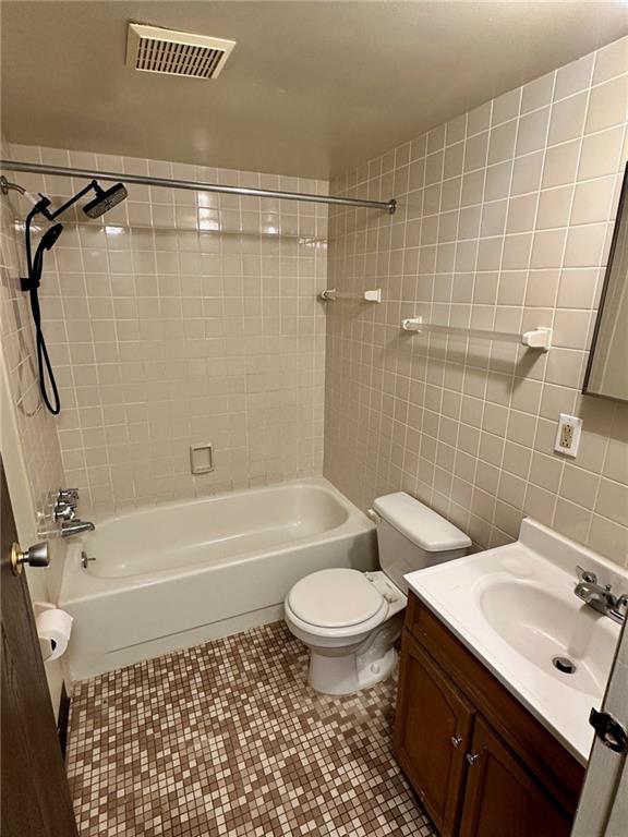 210 Electric Avenue, Unit B3 East Pittsburgh, PA 15112 - Photo 7 of 9 a bathroom with a sink a toilet and shower