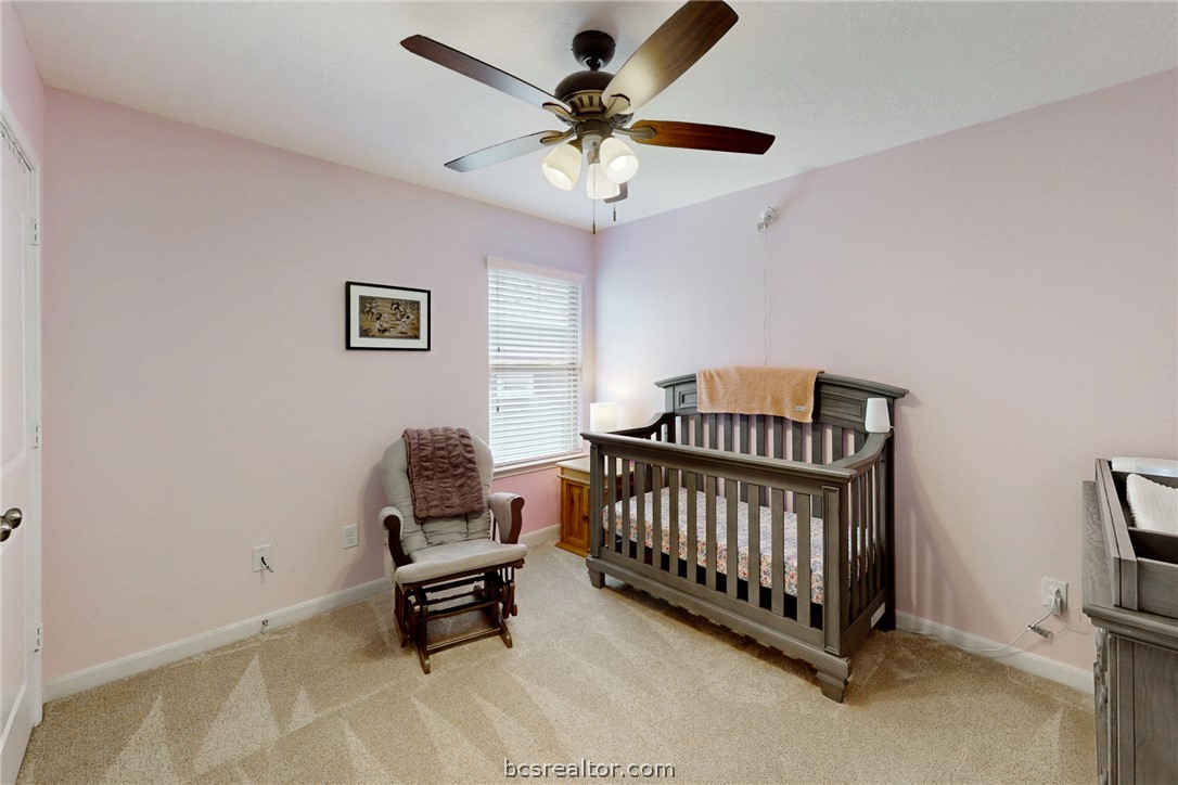 2071 Positano Loop Bryan, TX 77808 - Photo 24 of 31 a bedroom with furniture and a window
