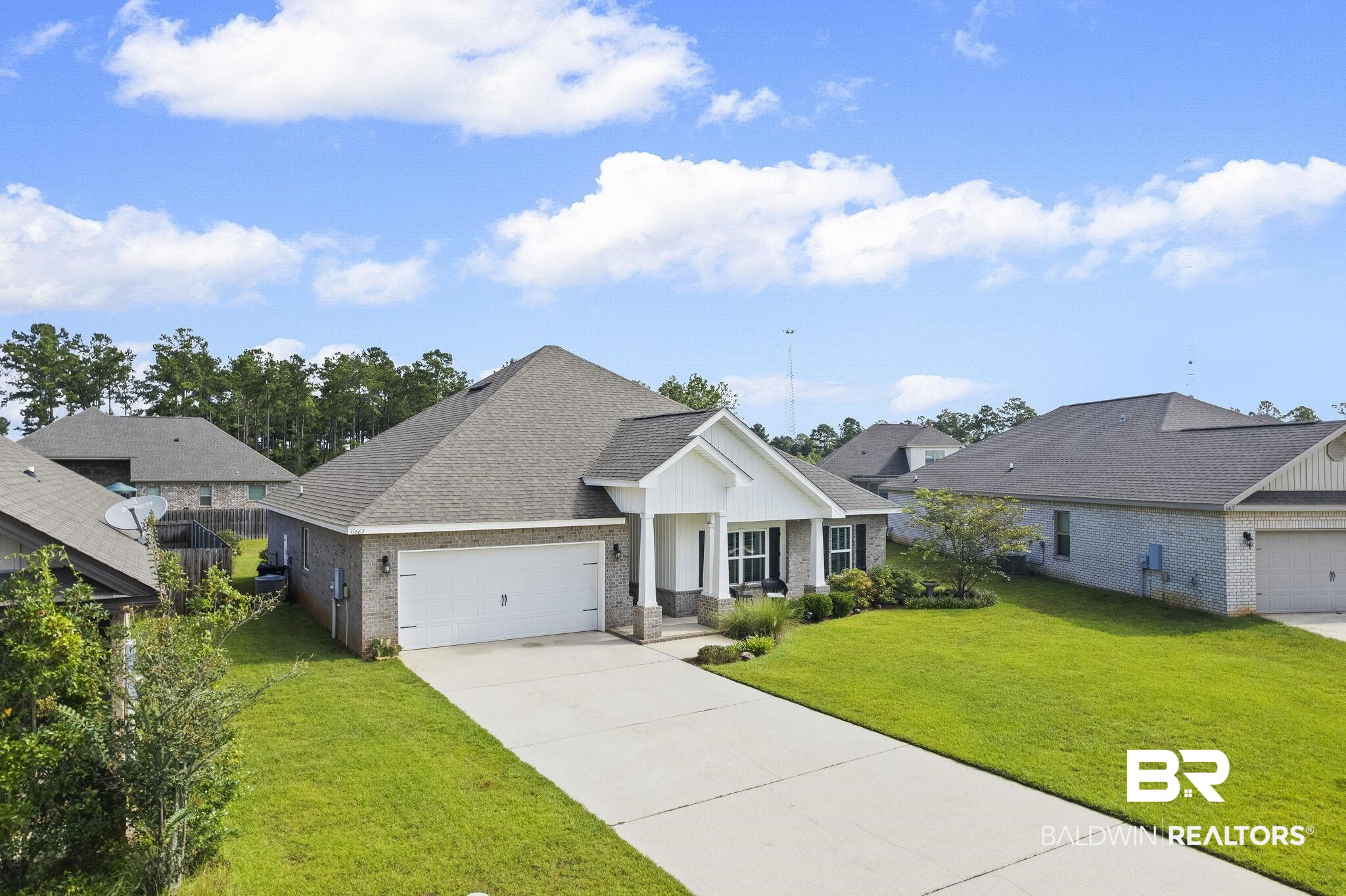 31663 Kestrel Loop Daphne, AL 36527 - Photo 63 of 86 View of front of house featuring a garage and a front lawn