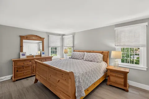 a bed room with a bed and a window