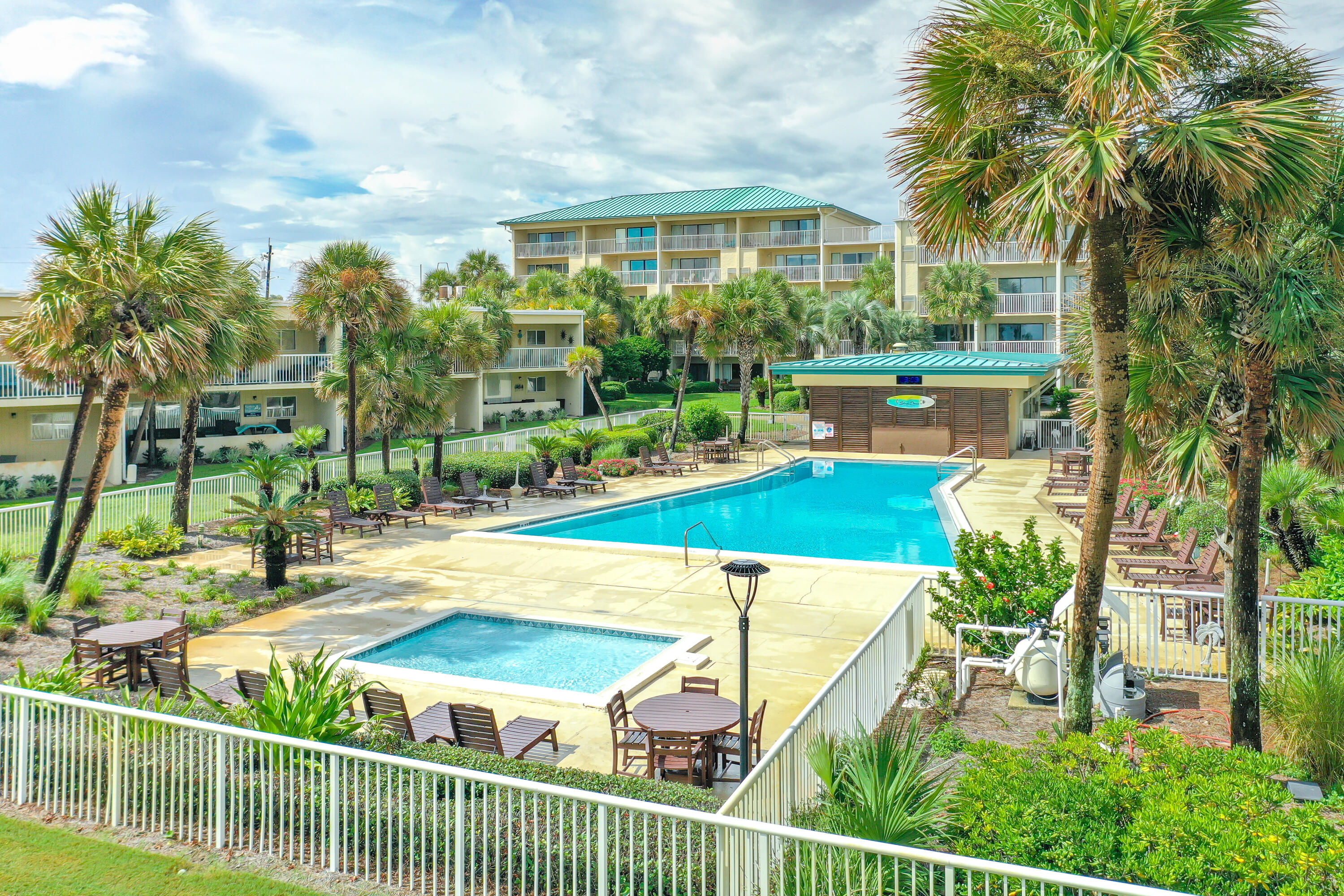1030 East E Highway, Unit 25 Destin, FL 32541 - Photo 28 of 34 a view of a swimming pool with a patio and a yard