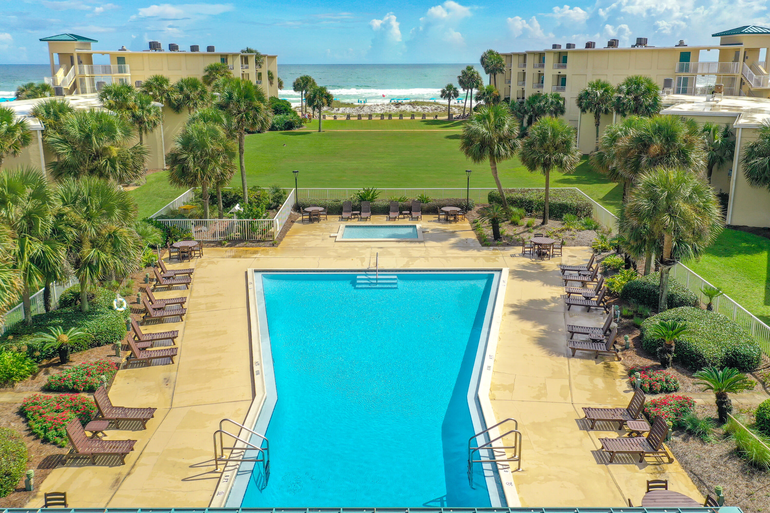 1030 East E Highway, Unit 25 Destin, FL 32541 - Photo 30 of 34 a view of a swimming pool with a yard