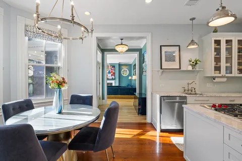 a view of kitchen with cabinets and wooden floor