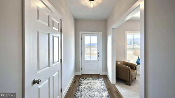 a living room with furniture and a lamp