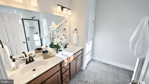 a bathroom with a glass shower door