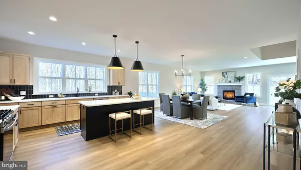 a kitchen with a refrigerator and dining table