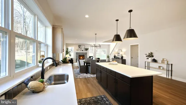 a very nice looking room with a large window and furniture