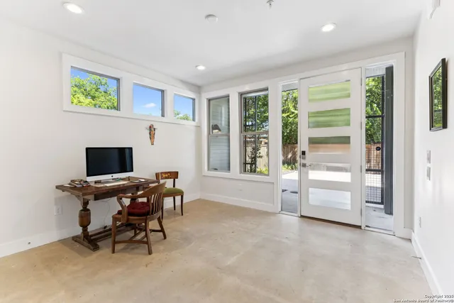 a workspace with furniture and a window